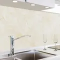 Produktbild: danario Küchenrückwand selbstklebend - Glasoptik - Spritzschutz Küche - versteifte PET Folie - 0,8 mm - Marmor beige - 60cm x 340cm