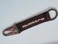 Produktbild: Audi quattro Schlüsselanhänger in Schwarz/Weiß mit Textilband ca.12x3cm NEU