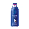 Produktbild: Beiersdorf AG NIVEA Reichhaltige Body Milk, mit tiefenpflegendem Serum, Bis zu 72 Stunden intensive Feuchtigkeit mit Mandelöl und purem Hyaluron, 400 ml - Flasche