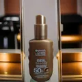 Produktbild: Garnier Ambre Solaire Sonnenpray ideal bronze milk-in Spray, LSF 50, 150 ml