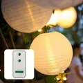 Produktbild: 12x 30cm Lampions outdoor weiß, 12x Batterie LED warmweiß mit Fernbedienung