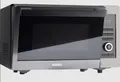 Produktbild: KOENIC KMWC 3019 DB, Mikrowelle (1000 Watt, Grillfunktion, Heißluftfunktion) NEU