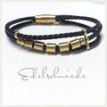 Produktbild: mehrreihig geflochtenes Textilarmband schwarz mit Edelstahlschließe vergoldet (M