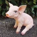 Produktbild: Gartenfigur sitzende Schweine Figur 23 cm