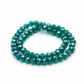 Produktbild: Vintageparts Glasschliffperlen Rondell Petrol 8x6mm facettierte Glasperlen zum Basteln für Schmuck 1 Strang ca. 60 Stück Fädelloch 1,5mm DIY Perlenstrang
