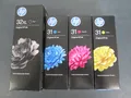 Produktbild: HP 32XL schwarz + HP 31 cyan, magenta, yellow  Smart Tank Tinte