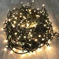 Produktbild: 300er LED-Lichterkette Weihnachtbeleuchtung warmweiß innen & außen mit Trafo Kabel grün