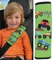 Produktbild: HECKBO 1x Kinder Auto Gurtpolster Gurtschutz mit Monster Truck Motiv - Sicherheitsgurt Polster für Kinder und Babys- Ideal für jeden Gurt Autositzerhöhungen Kinder Fahrradanhänger Flugzeug Jungen