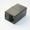 Produktbild: Modular-Adapter ISDN 8P8C RJ-45 Kabel-Verbinder Buchse Bu/Bu schwarz Kupplung
