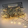 Produktbild: Konstsmide Micro LED Büschellichterkette Cluster, mit Aufroller, 400 bernsteinfarbene Dioden, 12V Außentrafo, dunkelgrüner Draht - 6471-830