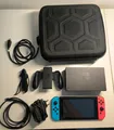 Produktbild: Nintendo Switch Spielkonsole mit Tragetasche (HAC-001, 32GB, Neon-Rot/Neon-Blau)