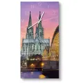 Produktbild: DEQORI Wanduhr 'Kölner Wahrzeichen abends' (Glas Glasuhr modern Wand Uhr Design Küchenuhr) gelb|lila 30 cm x 60 cm
