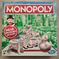 Produktbild: Hasbro 0417C1009100: Monopoly - Das berühmte Spiel um den großen Deal [Gesellsch