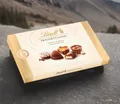 Produktbild: (63,52€/1kg) Lindt Pralines Classic Schokolade 4 x 125g Packung